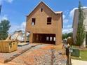 An unfinished two-story home with a garage opening ready for customization at 116 Winsome Way, Woodstock, GA 30188
