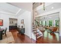 Welcoming foyer leading to a living room and kitchen, highlighting beautiful hardwood floors at 2564 Walden Estates Dr, Marietta, GA 30062