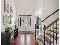 Bright foyer with hardwood floors, high ceilings, staircase and double doors with glass inserts at 2564 Walden Estates Dr, Marietta, GA 30062