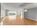 Spacious living area featuring hardwood floors, recessed lighting, and an elegant chandelier at 3475 Oak Valley Road Ne # 870, Atlanta, GA 30326