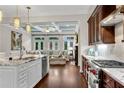 Modern kitchen featuring granite countertops and stainless steel appliances, seamlessly connected to a cozy living room at 3663 Brookhaven Manor Ne Xing, Atlanta, GA 30319