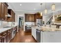 Bright kitchen featuring custom wood cabinets, stainless steel appliances, and a granite island at 3663 Brookhaven Manor Ne Xing, Atlanta, GA 30319