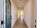 Bright entryway featuring beautiful floors and modern lighting, leading into a spacious interior at 4202 Adler Cir, Buford, GA 30519