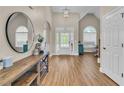 Inviting foyer with hardwood floors, high ceilings, arched doorways, and natural light at 2850 Dartmouth Pl, Cumming, GA 30041
