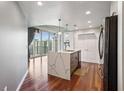 Modern kitchen featuring quartz countertops, stainless steel appliances, and hardwood floors at 860 Peachtree Ne St # 1417, Atlanta, GA 30308