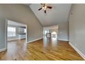 Bright and airy living room with hardwood floors, vaulted ceiling, and ample natural light at 1550 Royale Castle Dr, Lawrenceville, GA 30043