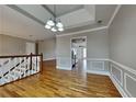 Spacious living room featuring hardwood floors, decorative trim, and a stylish ceiling at 1550 Royale Castle Dr, Lawrenceville, GA 30043