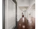 Elegant entryway with hardwood floors, white trim, and a view of the living room at 4735 Belcrest Way, Cumming, GA 30040