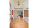 Inviting foyer with hardwood floors flows into a living area with a fireplace at 2016 Westbourne Way, Johns Creek, GA 30022