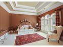 Cozy living room showcasing a decorative rug and a large window at 2016 Westbourne Way, Johns Creek, GA 30022