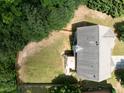Aerial view of a home with a large, expansive backyard surrounded by mature trees at 3070 Jardin Nw Ln, Kennesaw, GA 30152