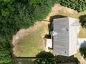 Aerial view of the backyard with a fence and mature trees at 3070 Jardin Nw Ln, Kennesaw, GA 30152