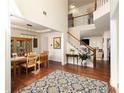 Welcoming foyer with hardwood floors and a staircase leading to the second floor at 3070 Jardin Nw Ln, Kennesaw, GA 30152