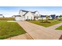 Beautiful home exterior, with a long driveway and a two-car garage at 137 Bastian Rd, Mcdonough, GA 30252
