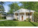 Traditional home with a well-manicured lawn, brick facade, wooden shutters, and inviting front entrance at 2202 Green Forrest Dr, Decatur, GA 30032