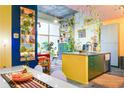 Open-concept kitchen with colorful decor, granite countertops, and a large island for entertaining at 130 Arizona Ne Ave # 415, Atlanta, GA 30307