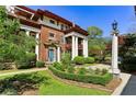 Charming brick building featuring symmetrical columns and lush landscaping in a residential neighborhood at 746 N Highland Ne Ave # 6, Atlanta, GA 30306