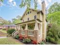 A beautiful, well-maintained home is partially visible beyond the treeline at 1745 Mary Lou Ln, Atlanta, GA 30316