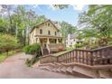 Lovely two-story home featuring a covered front porch and meticulous landscaping at 1745 Mary Lou Ln, Atlanta, GA 30316