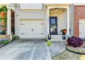 Charming home entrance showcasing a garage, driveway, and landscaped entrance at 2685 Maple Park Pl # 27, Cumming, GA 30041