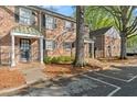 Brick townhouses with covered porches and parking at 6700 Roswell Rd # 20D, Sandy Springs, GA 30328