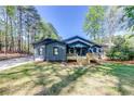 Well-maintained front exterior with a cozy porch and inviting curb appeal at 1762 Green Rd, Buford, GA 30518