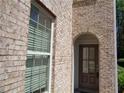 Front door entrance with brick facade and arched doorway at 1835 Morning Star Ln, Tucker, GA 30084