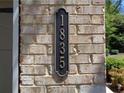 Close-up of the house number 1835 displayed on a brick wall at 1835 Morning Star Ln, Tucker, GA 30084