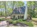 A well-kept home with fresh bushes, a manicured lawn, and walkway leading to the front door at 1153 Haven Brook Ln, Brookhaven, GA 30319