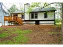 Spacious backyard featuring a wooden deck and lush green surroundings at 4907 Windsor Downs Dr, Decatur, GA 30035