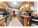 Functional kitchen with wood cabinets, stainless steel appliances, and convenient access to the dining area at 2172 Oakland Ridge Dr, Lawrenceville, GA 30044