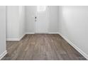 Charming entryway featuring durable wood-look flooring, complemented by neutral walls and trim for a clean, welcoming aesthetic at 342 Overlook Rd, Covington, GA 30014