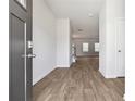 Inviting entryway with wood-look flooring leading into a spacious living area, offering a seamless transition and modern aesthetic at 342 Overlook Rd, Covington, GA 30014