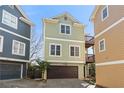 Charming two-story home featuring a two-car garage and two small decks at 735 Ponce De Leon Pl Ne Unit 1, Atlanta, GA 30306