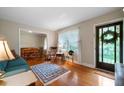 Cozy living room with hardwood floors, large windows, and comfortable furnishings at 5839 Darry Cir, Norcross, GA 30093