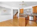 Open concept kitchen with a center island, stainless steel appliances, and natural wood cabinets at 2775 Loftview Sq # 8, Atlanta, GA 30339