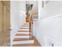 Elegant foyer featuring a curved staircase with hardwood steps and iron spindles at 2775 Loftview Sq # 8, Atlanta, GA 30339