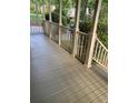 Spacious front porch with painted wood flooring and railing offers an inviting outdoor space at 863 Fairwood Pointe Nw, Acworth, GA 30101