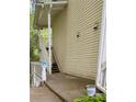 View of the exterior stairs leading to the upper levels of the condo with beige siding at 1504 Augusta Se Dr, Marietta, GA 30067