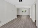 Inviting room with smooth walls, new floors, and a view of a window providing natural light at 1728 Line St, Decatur, GA 30032