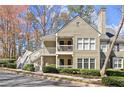 Attractive condo with balcony, complemented by lovely trees and well-kept grounds at 208 Bainbridge Dr, Atlanta, GA 30327