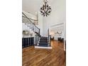 Grand foyer with hardwood floors, high ceilings, elegant chandelier, and staircase at 1151 Goodwin Ne Rd, Brookhaven, GA 30324