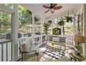 Inviting screened-in porch with comfortable seating and peaceful wooded views at 1420 Lockridge Dr, Cumming, GA 30041