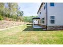 A large backyard perfect for pets, play, or entertaining with a covered back porch at 4275 Montane St, Cumming, GA 30028