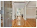 Elegant entryway with hardwood floors, high ceilings, and views into the living room at 5177 Cabot Creek Dr, Buford, GA 30518
