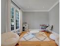 Cozy sitting room featuring hardwood floors, plush seating, and a bright window at 5177 Cabot Creek Dr, Buford, GA 30518