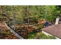 A spacious, fenced backyard with mature trees offering a private outdoor oasis at 660 Gran Heritage Way, Dacula, GA 30019