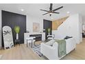 Bright living room with fireplace, modern furniture, and beautiful wood floors at 906 Mcdaniel St, Atlanta, GA 30310