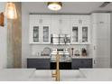 Well-equipped kitchen featuring white cabinets, stainless steel appliances, and modern finishes at 245 N Highland Ne Ave # 220, Atlanta, GA 30307