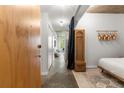 Cozy bedroom with a unique design, concrete ceiling, and an open view of the hallway at 245 N N Highland Ne Ave # 220, Atlanta, GA 30307